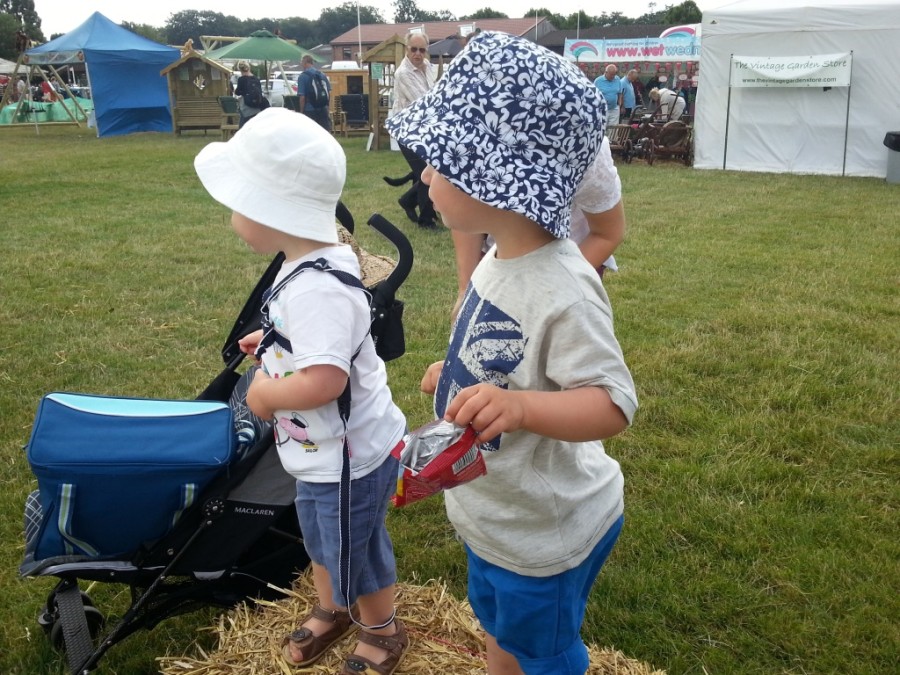 boys on a straw bale