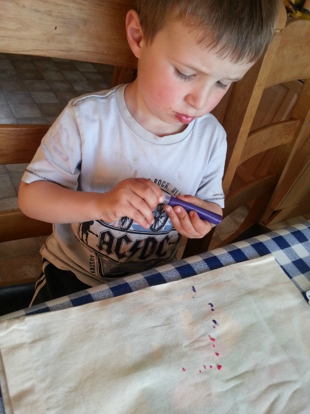 painting a bag with fabric paints