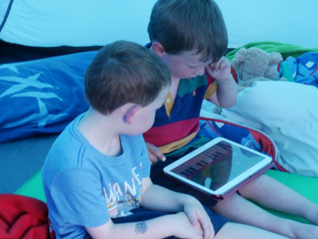 2 boys playing with a Samsung Tablet