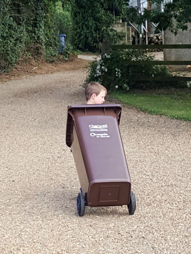 helping out and taking the recycling wheely bin to the farm gate