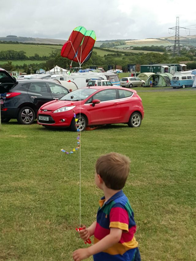 flying a kite - pocket parafoil kite in a pack