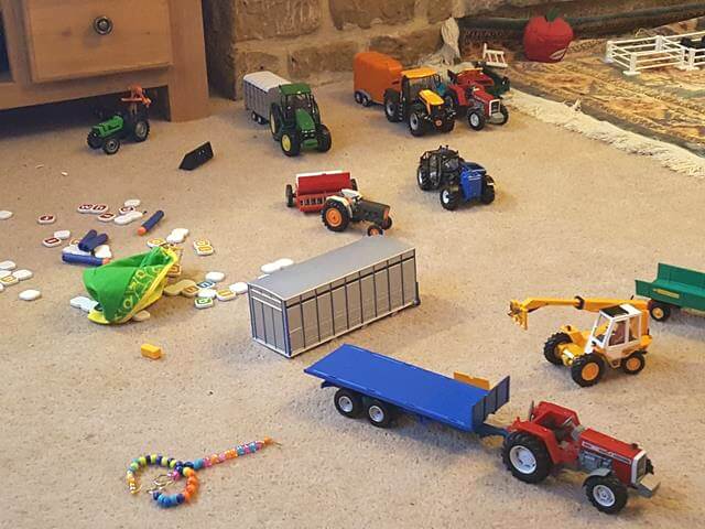 farm toys strewn on carpet