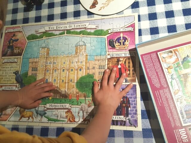 enjoying a 100 piece tower of london jigsaw puzzle