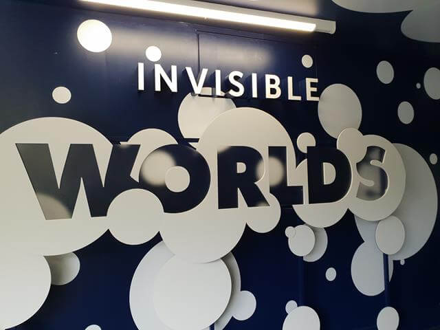 invisible worlds sign