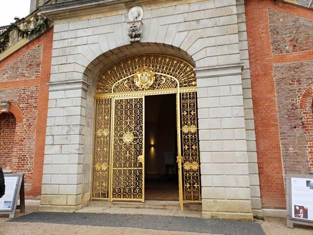 golden archway gates at cliveden