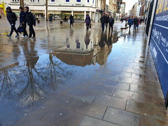 reflections of Oxford shopping street and trees