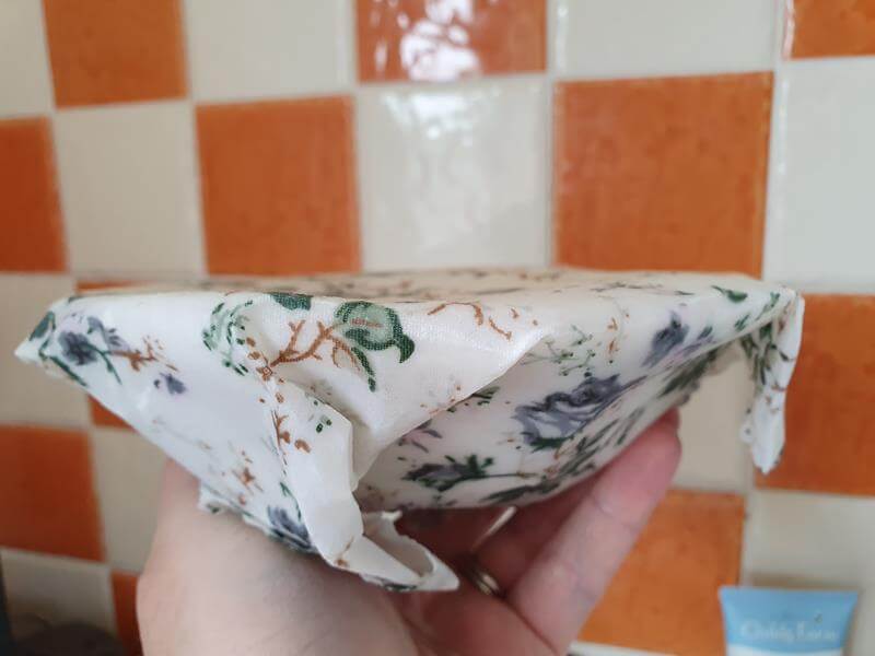 how the beeswax wrap fits around a bowl