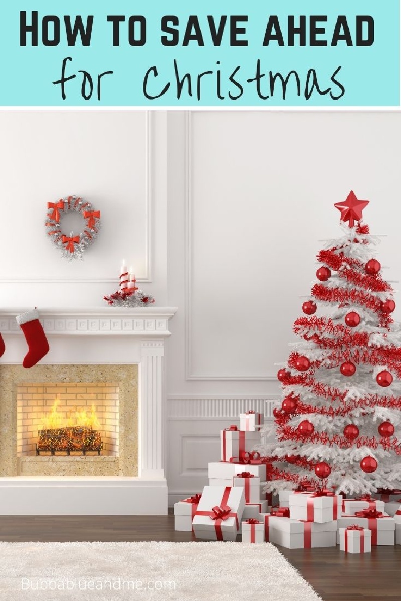 How to save ahead for Christmas - white christmas tree decorated in red, in a white room with fireplace