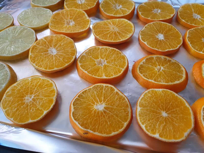 close up on sliced clementines for drying