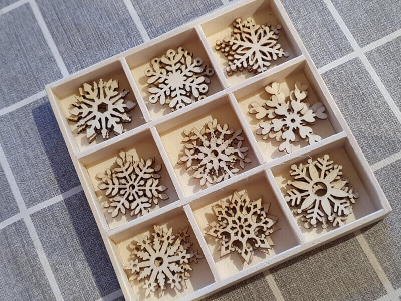 wooden snowflakes for crafts in a box