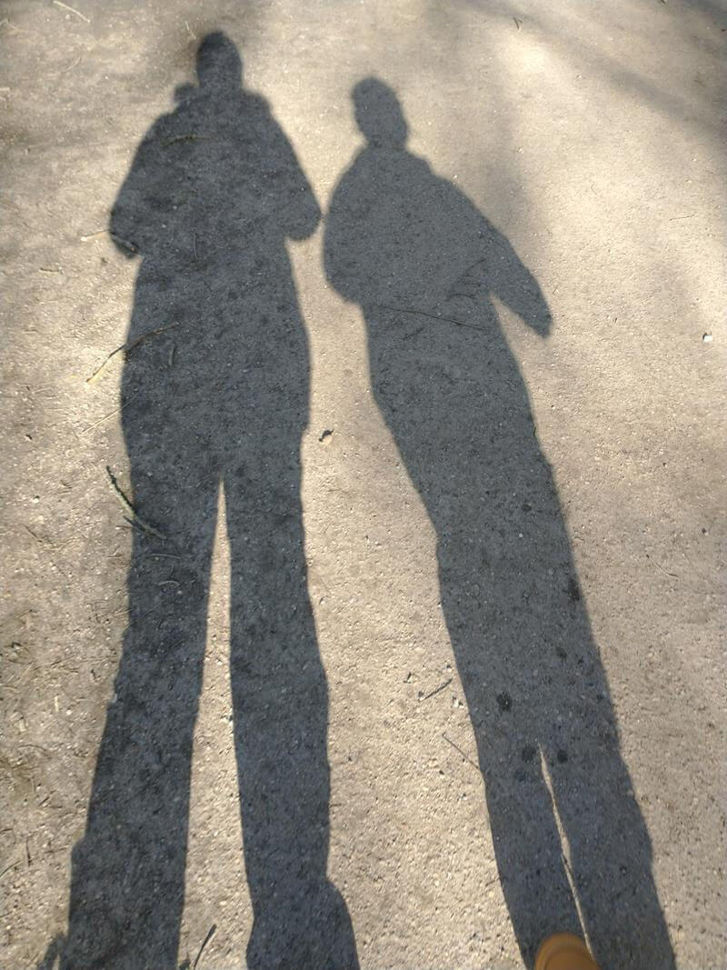 mum and son's shadows on the ground