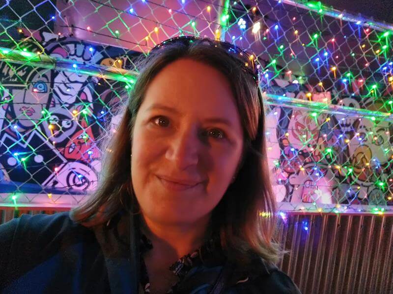 selfie infront of colourful lights