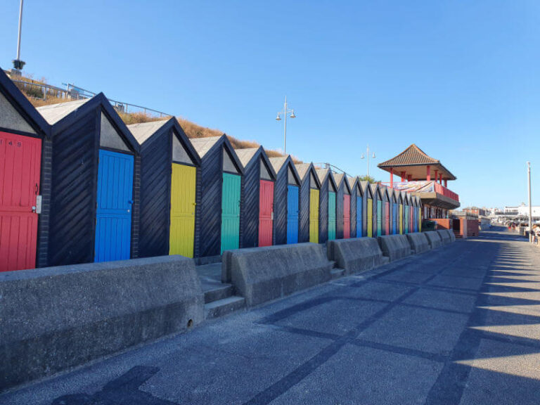 black and colourful doors of beach huts on the sea front at lowestoft