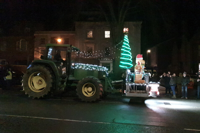 tractor lit up with christmas tree