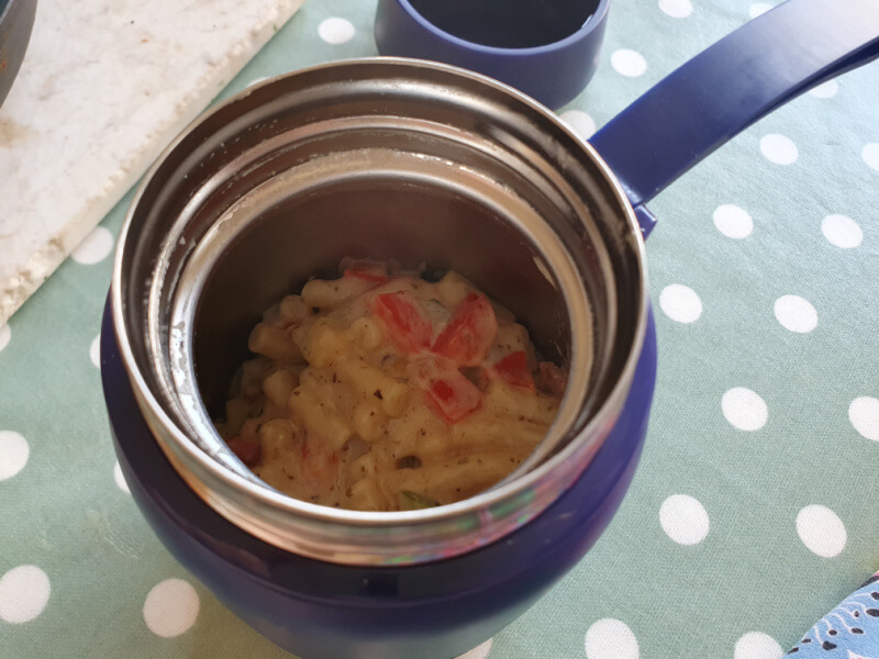 looking down into macaroni cheese inside a food flask