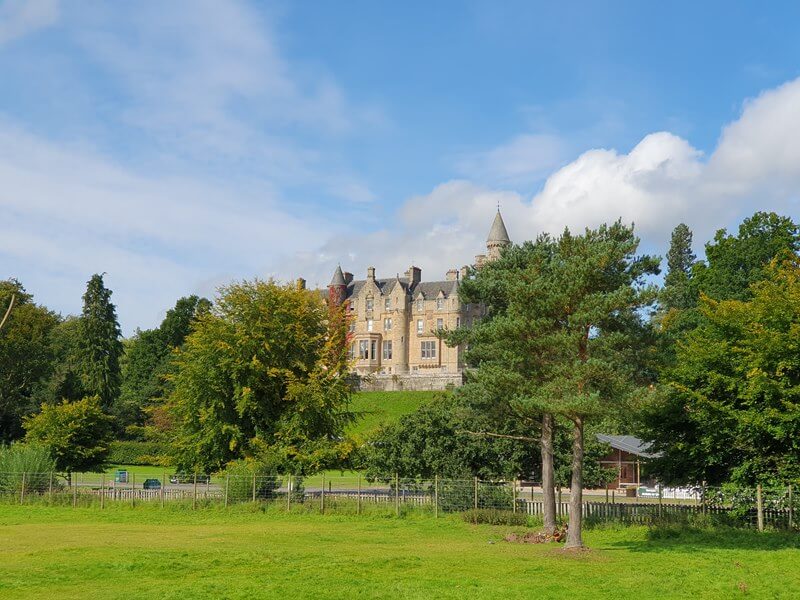 Stately home behind tress