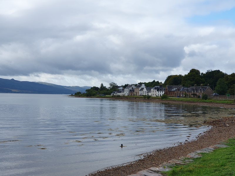 looking along the side of loch fyne in inveraray towards the houses on the edge of the loch