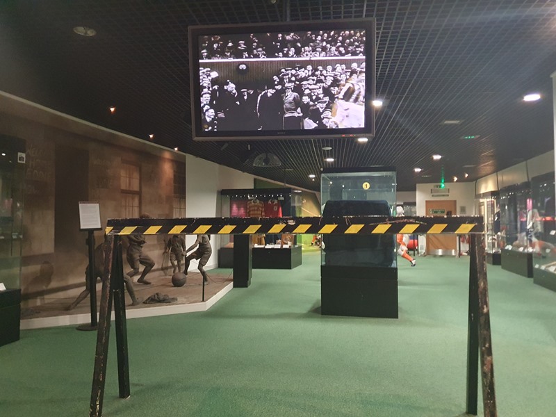 old film footage of football match, looking down the football museum