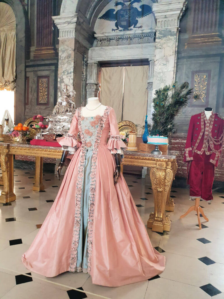 Queen Charlotte pink dress from Netflix show in Blenheim Palace dining room