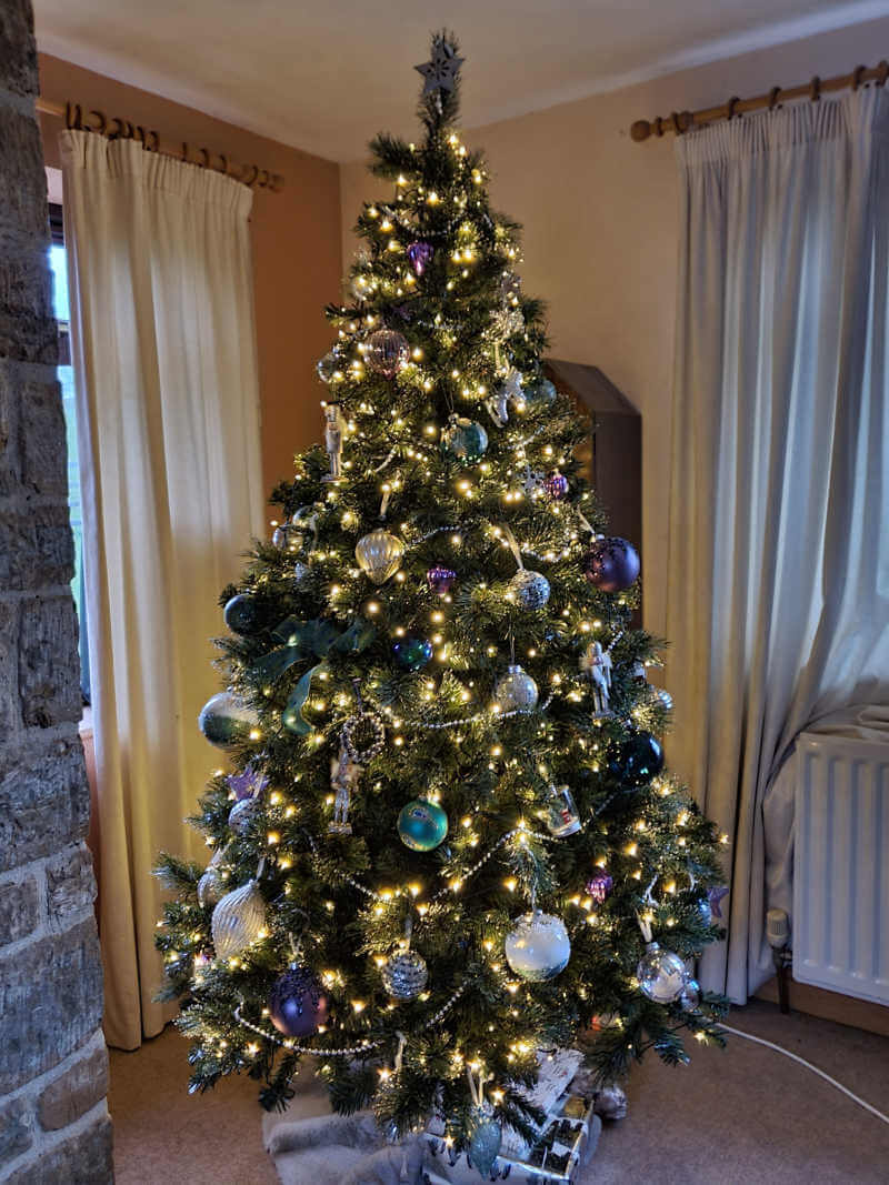 full christmas tree decorated with lights