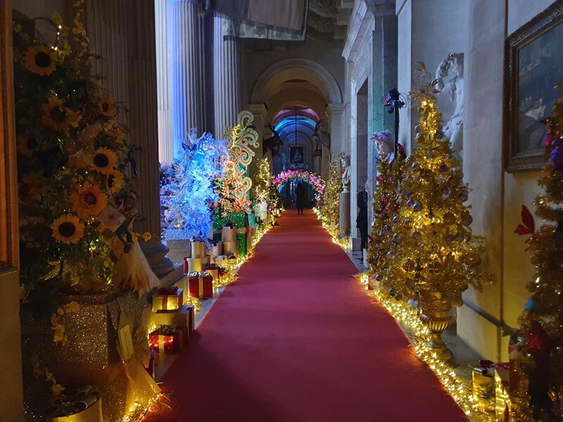 corridor of christmas trees and lights
