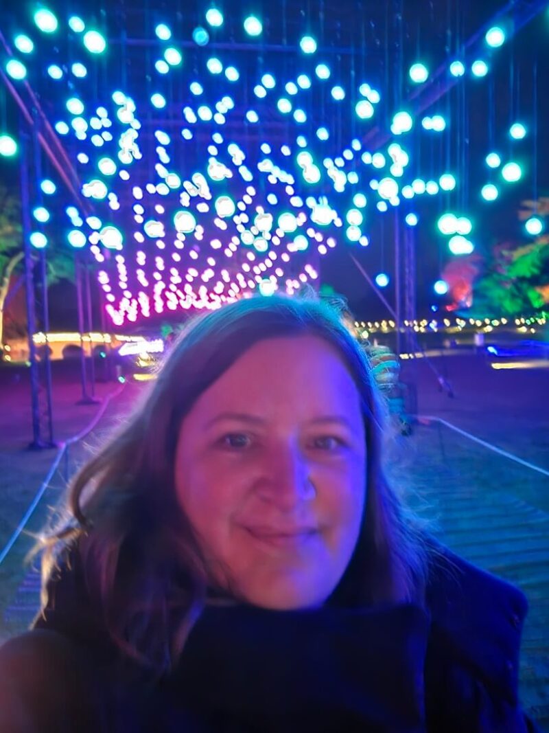 selfie underneath ball lights all out of focus
