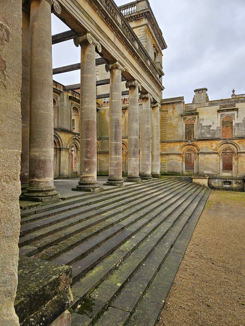 the steps and pillars up from the courtyard entrance