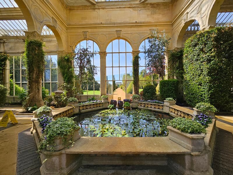 looking towards the pond in the orangery and out of the arch windows down the garden