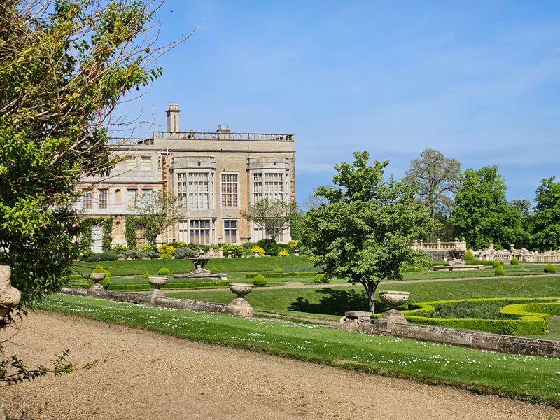 side view of Castle Ashby house across formal gardens