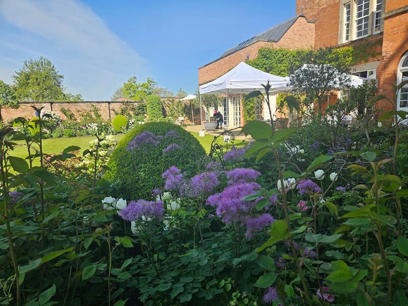 view of morton hall back from the flower borders