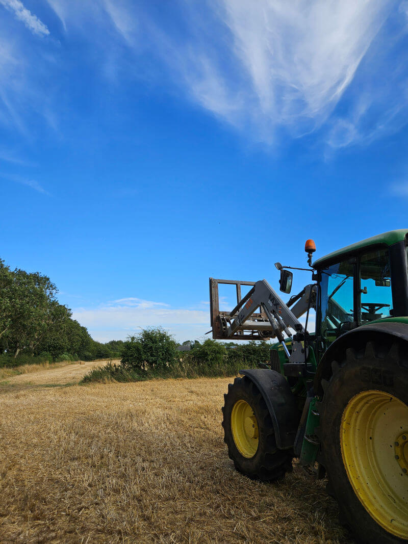 john deere tractor ready to finish bale carting