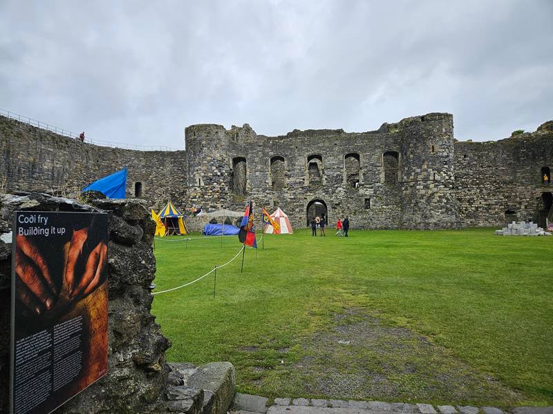 beaumaris castle courtyard with activity tents