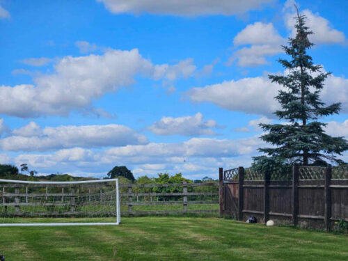 garden shot with perfect clouds and football goal