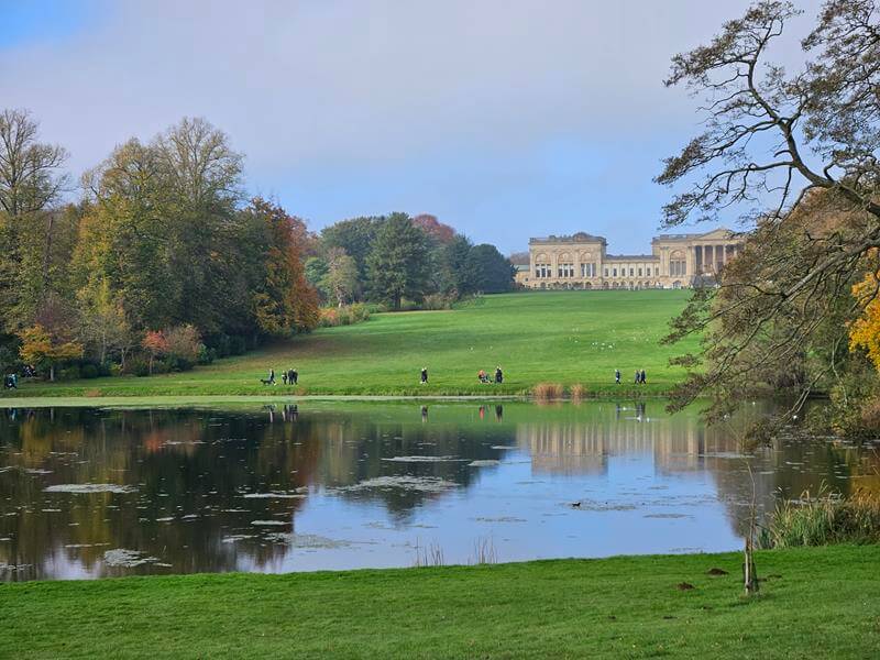 sunny view across the lake to stowe house