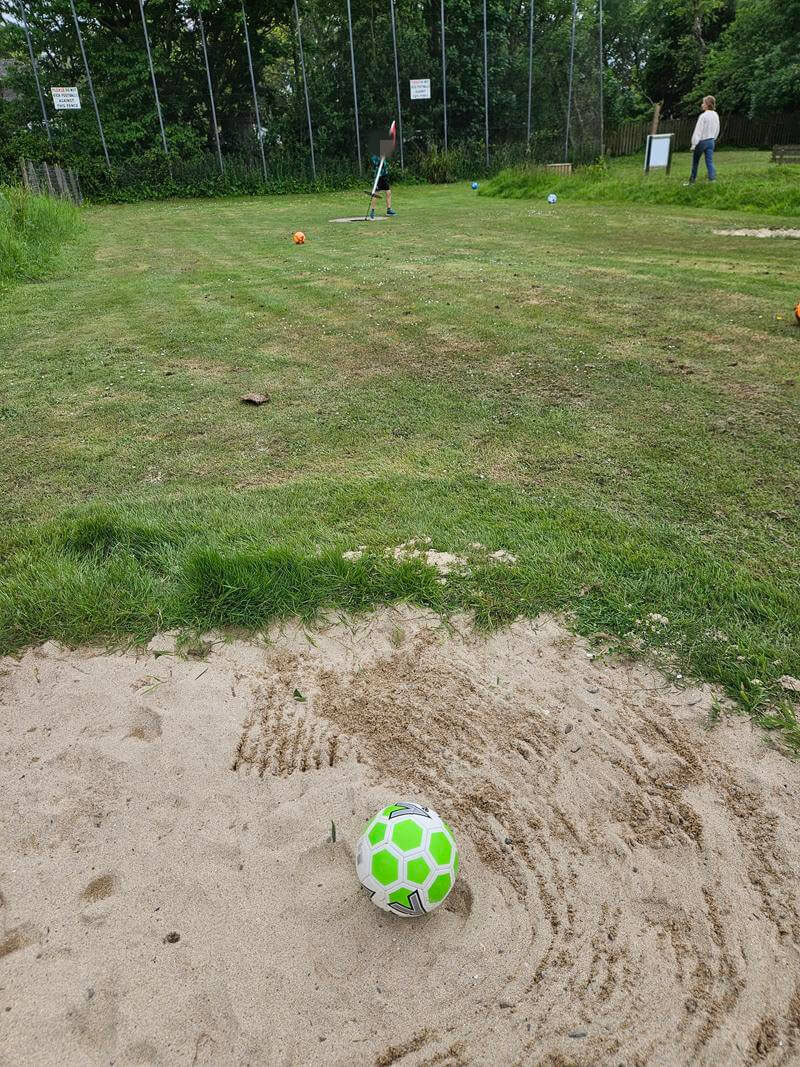 football in the bunker in footgolf