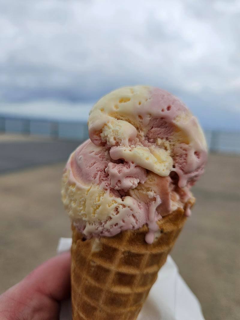 rhubarb and custard ice cream in waffle cone