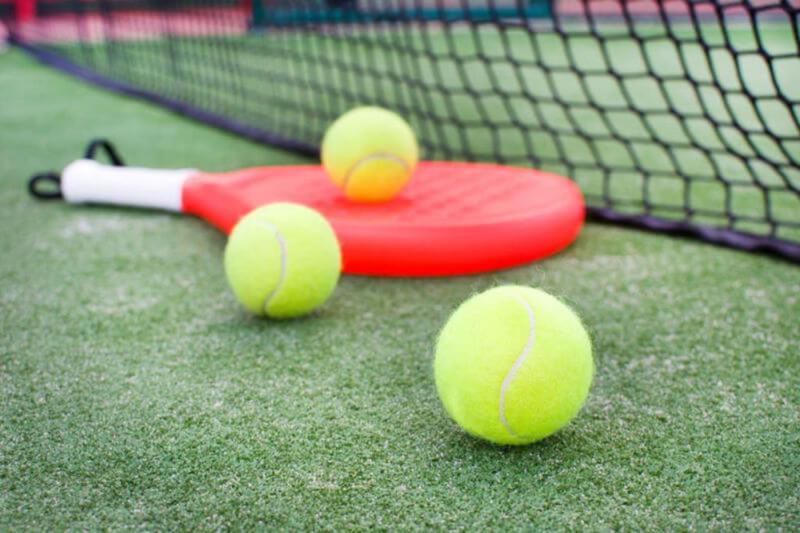 paddle tennis racket and ball.