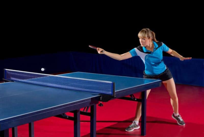 table tennis woman player at table.