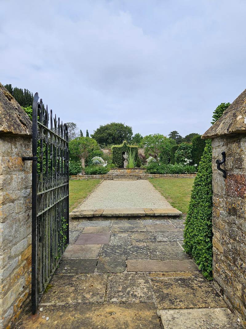looking through gates into pool garden